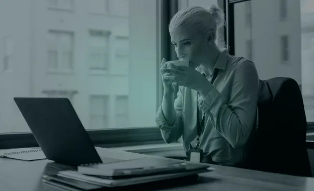 Woman in front of a computer using Slack